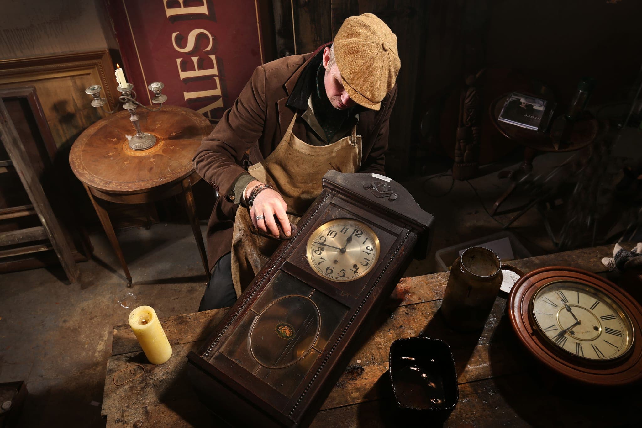 Rob Cain working on an antique clock restoration with specialized tools